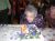 Lucille Dusseau Tambeau blowing out the candles on her 100th birthday cake